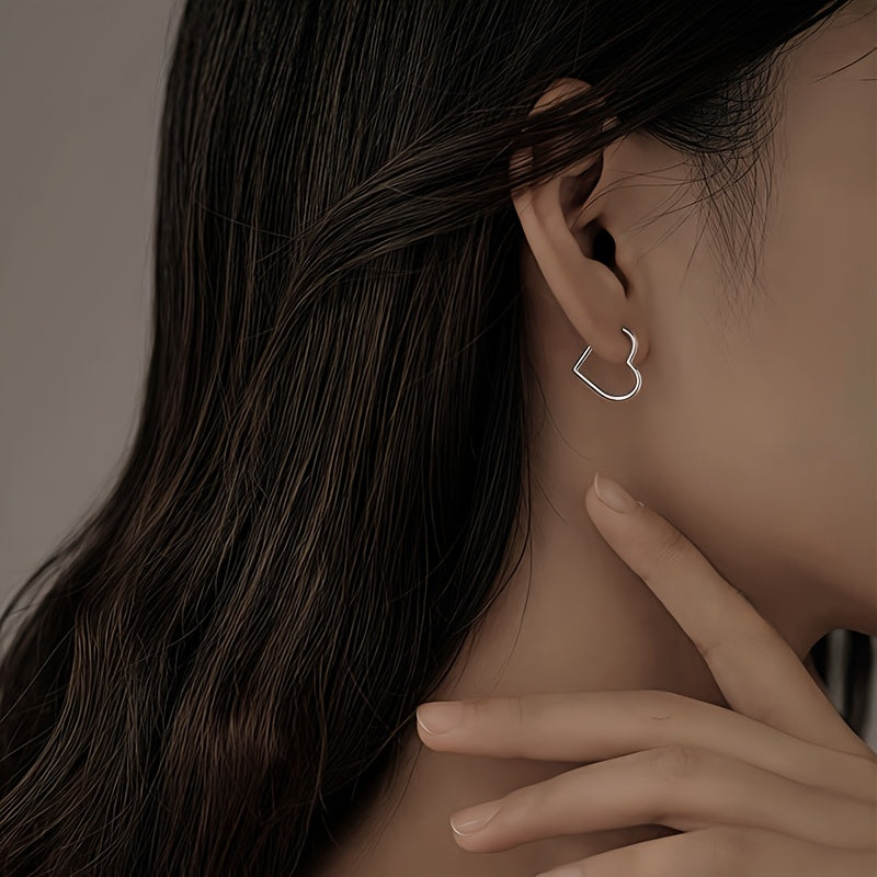 Hjärtformade örhängen i rostfritt stål i guld