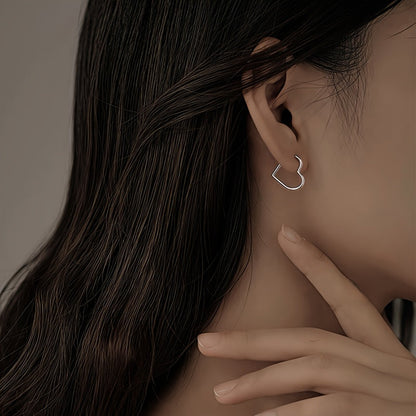 Hjärtformade örhängen i rostfritt stål i guld