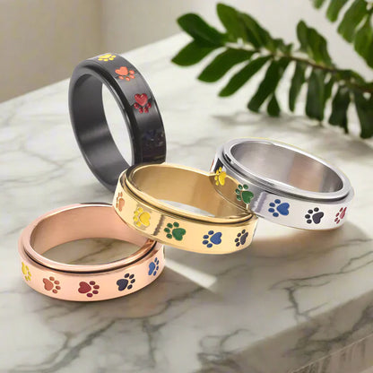 Snurrande tassformad stressavlastningsring