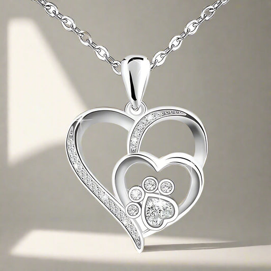 Sterling silver chain with paw print and heart, set with zirconia.